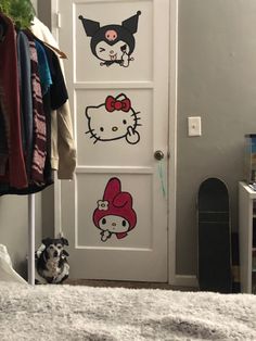 a door with hello kitty decals on it and a dog sitting next to it