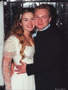 a man and woman posing for a photo together