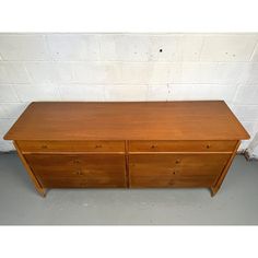 a large wooden dresser with two drawers