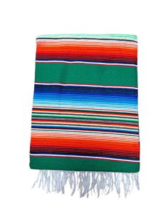 a multicolored striped blanket with fringes