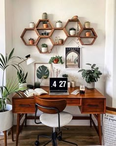 a desk with some plants on top of it