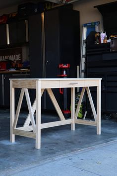 a workbench in a garage with tools on it