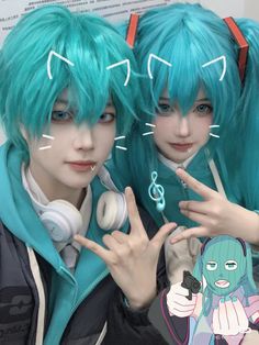 two people with blue hair and headphones are posing for the camera while holding their hands up