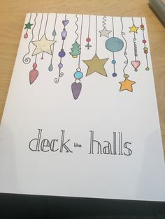 a card with the words deck the hallies hanging from strings