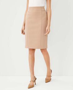 Elevate your office wardrobe with the Ann Taylor Tall High Waist Seamed Pencil Skirt in a chic Natural Camel shade. This skirt combines style and comfort, crafted from a blend of 78% polyester, 15% viscose, and 7% spandex, ensuring a stretchy yet form-fitting silhouette that resists wrinkles throughout the day.

- **Color:** Natural Camel
- **Material:** Polyester, Viscose, Spandex
- **Size:** 4 (Tall)
- **Gender:** Female
- **Features:** High waist, seamed detailing, hidden back zipper with hoo Beige Pencil Skirt, Office Wardrobe, Tweed Pencil Skirt, Knitted Suit, Hm Skirt, Blazer And Skirt, High Waisted Pencil Skirt, Pencil Skirts, Office Attire