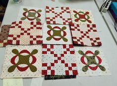 the quilts are laid out on the table to be sewned and stitched