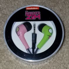 two earbuds in the shape of an animal headphones with neon green and pink ears