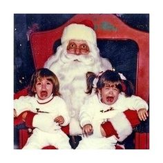 an old photo of santa claus with two children and the caption says, have a paranoid christmas