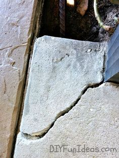 a cement slab that has been cut in half and is being used as a planter