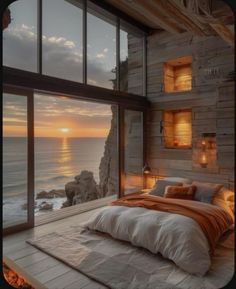 a bedroom with a large window overlooking the ocean