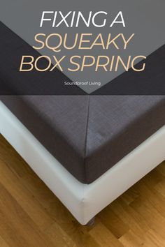 a square box spring sitting on top of a bed with the words fixing a squeaky box spring