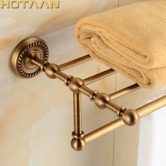 a towel rack with two towels hanging on it