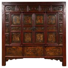 an old wooden cabinet with carvings on it