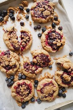 blueberry crumb cookies are on a baking sheet