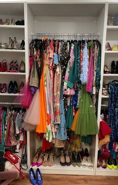 a closet filled with lots of different types of shoes and dresses on shelves next to each other