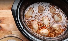 the food is being cooked in the slow cooker