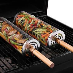 two rolls of food cooking on top of an open grill