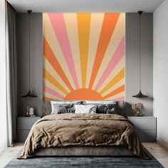 a bedroom with a large bed and an orange sun painted on the wall above it