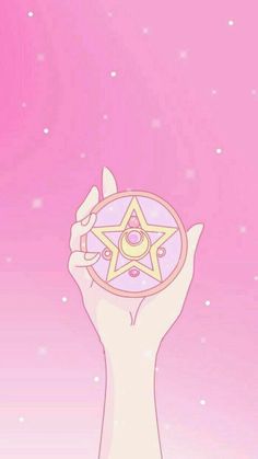 a person holding up a star in their hand