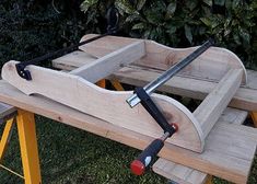 a wooden bench that has some tools on it