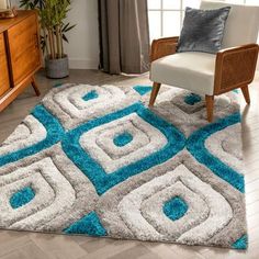 a living room with a chair and rug on the floor