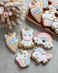 decorated cookies in the shape of unicorns and rainbows