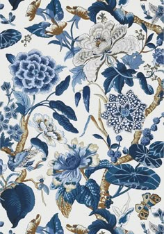 a blue and white floral wallpaper with lots of flowers on the top of it