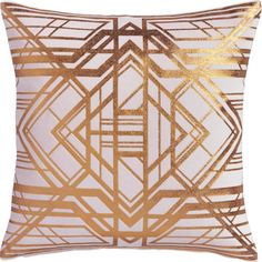 a gold and white pillow with an abstract design on the front, along with a metallic foil