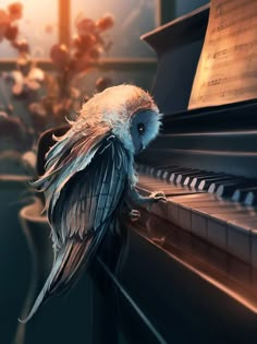 an owl sitting on the edge of a piano with its wings spread out and eyes closed