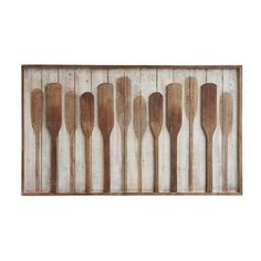 wooden spoons lined up in a row on a white background