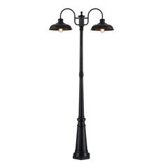 a black lamp post with two lights on each side and one light on the other