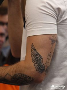 a man with a tattoo on his arm