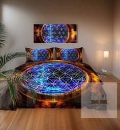 a bed with a flower of life design on it