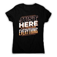 a black t - shirt that says just here to ignore everything