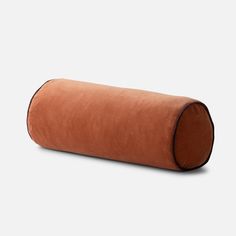 a brown leather tube on a white background