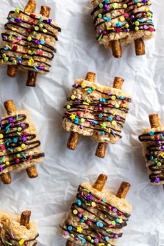 homemade christmas treats made from pretzels and marshmallows on white paper