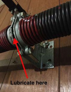 a close up of a metal object with a red arrow pointing to the bottom of it