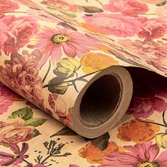 a floral wallpaper with pink, yellow and orange flowers on the bottom half of it