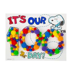 it's our 100th birthday card with pom - poms on the front