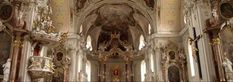 the interior of an old church with gold and white decorations