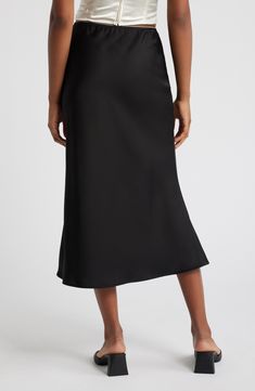 Sleek satin highlights your curves in this unforgettable midi skirt topped with the tiniest bow and dainty picot trim at the waist. 32 1/2" center front length (size Medium) Unlined 100% polyester Hand wash, line dry Imported Black Satin Midi Skirt, Tiny Bow, Satin Midi Skirt, Mid Length Skirts, Black Midi Skirt, Free Fabric, Black Fits, Dream Dress, Skirt Top