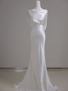 a white dress on display in a room