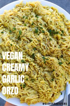 vegan creamy garlic orzo on a white plate