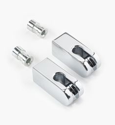 two chrome plated metal handles and knobs on a white background with space for text