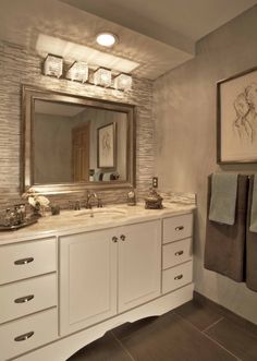 a bathroom with two sinks and mirrors in it