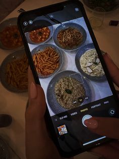 someone is taking a photo of food on their phone