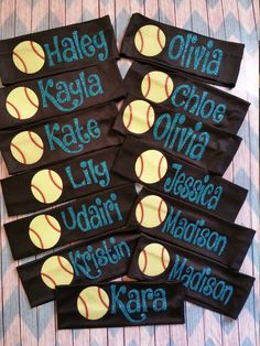 six personalized softball wristbands with name and ball on them, sitting on a table