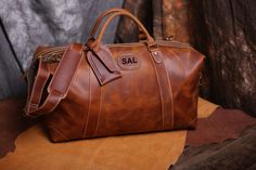 "25% off for 5 pcs to 9 pcs. 30% off for 10 pcs to 14 pcs. 35% off for 15 pcs or more. Discount shown at checkout. Distressed leather duffle bag for your most exciting trips, Vintage inspired design combined with the distressed leather gives a rich classy look. It is quite spacious and can easily store a 15\" iPad or laptop. You can also store a lot of essential items in this bag. The shoulder strap also features metal rings which recede when not being used. Available in two exquisite shades of Classic Portable Leather Bags, Classic Portable Travel Bag, Brown Portable Bag As Gift, Brown Travel Bag For Gift, Luxury Rectangular Travel Bag For Gift, Luxury Rectangular Travel Bag As Gift, Luxury Rectangular Travel Bag Gift, Large Leather Travel Bag Ideal As Gift, Brown Travel Bag With Luggage Sleeve As Gift