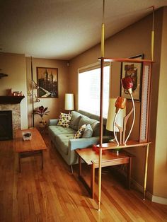 a living room filled with furniture and a fire place next to a wooden coffee table