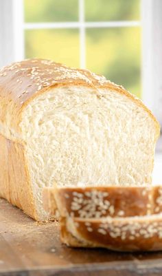 a loaf of bread sitting on top of a cutting board